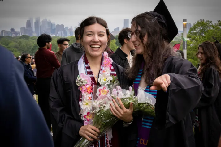 Students talk during post graduation reception