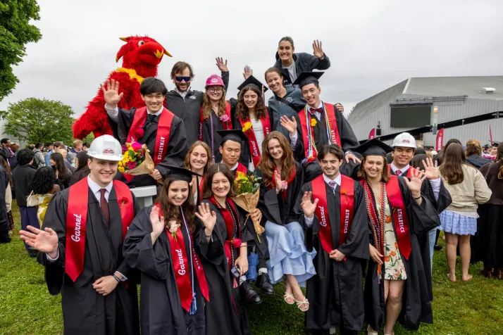 Members of the swim team pose together on Big Chair after graduation ceremony