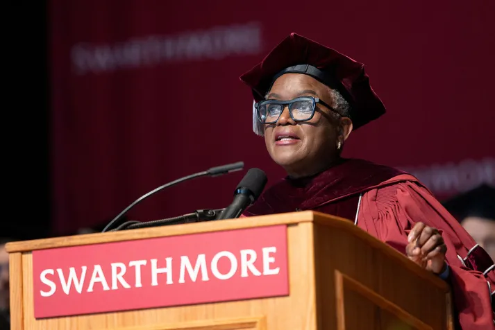 Val Smith at podium during commencement