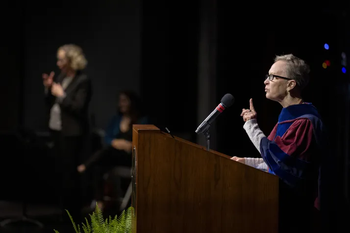 Diane Anderson speaks at podium