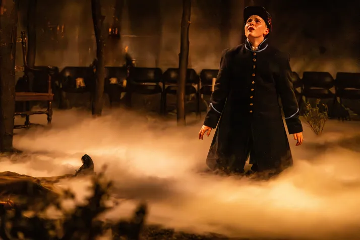 Andres looks at the sky after he's fallen to his knees. Fog rolls in around him 