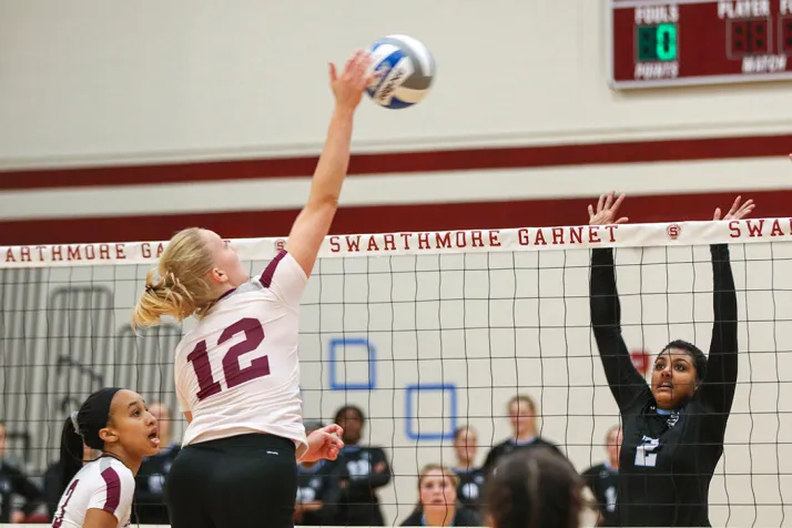 Volleyball player goes for kill on ball