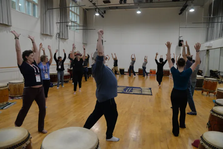 Alum participate in taiko drum circle