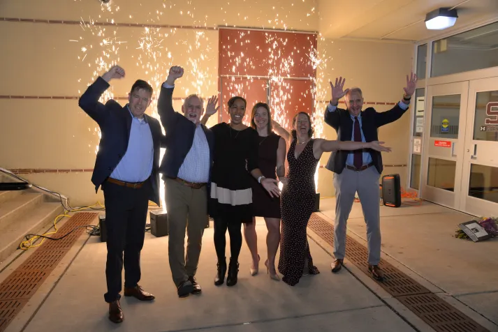 Hall of fame inductees celebrate in front of fireworks display