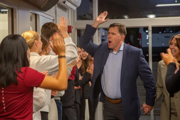 Pat Carney high fives students