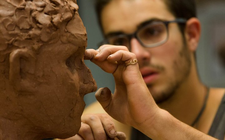 Student working on a sculpture