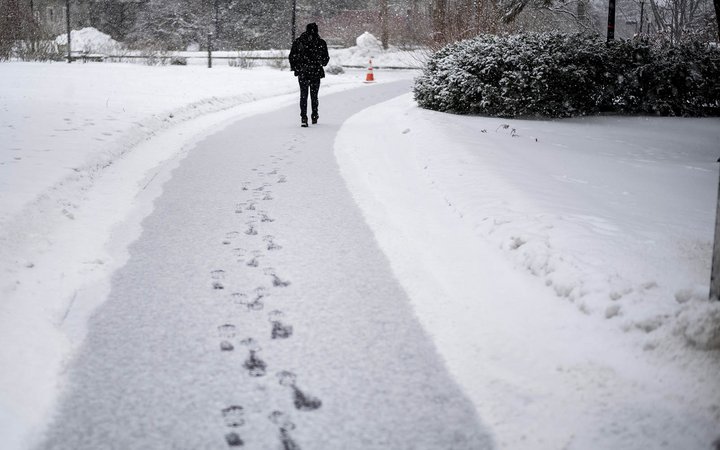 student walking in snow
