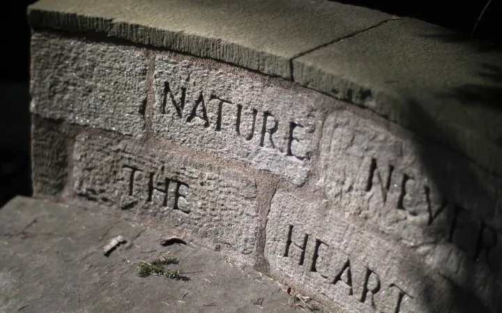 stone bench with inscription carved into back