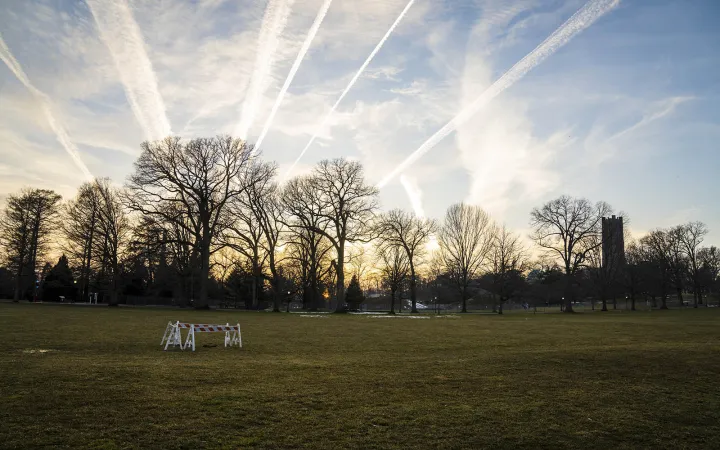 airplane contrails in the sunset sky