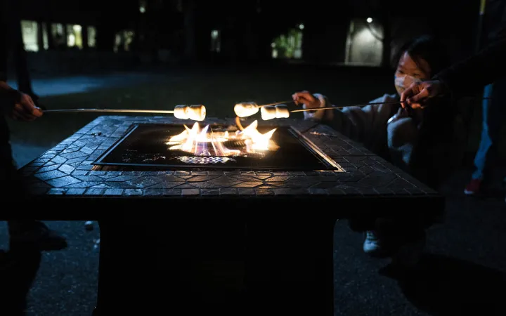 students roasting marshmellows