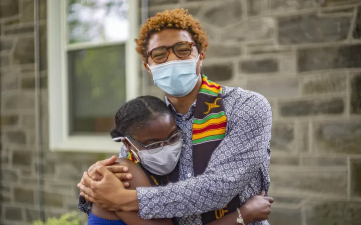 two students hugging