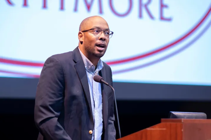 Speaker at podium during orientation event