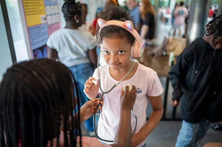CCC student listens to pulse with stethoscope 