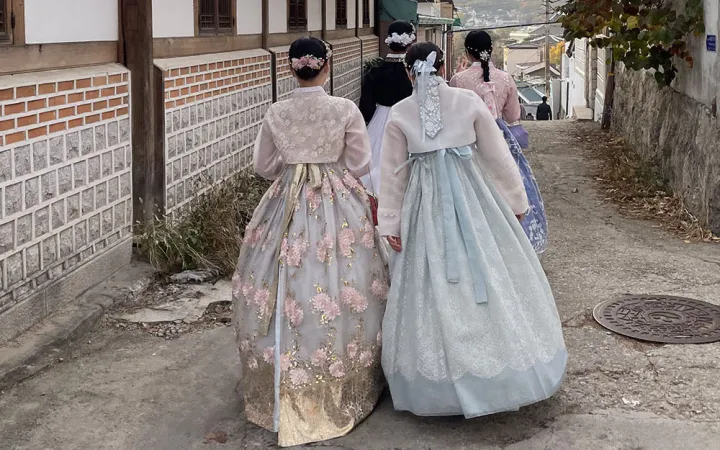 2 women in traditional dresses