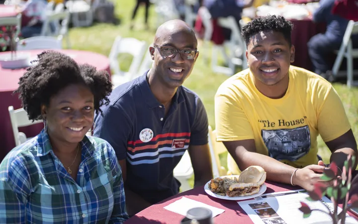 three people sitting at table