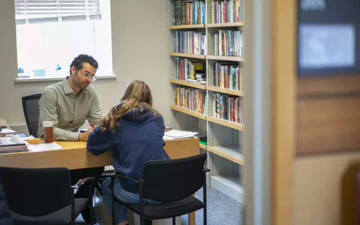 professor talking with a student
