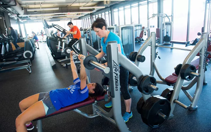 Student lifting weights in the Swarthmore gym