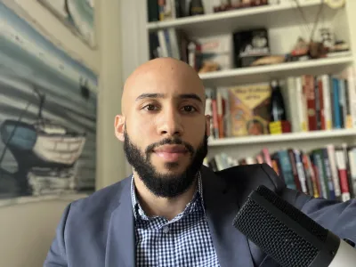 picture of a man sitting at his desk