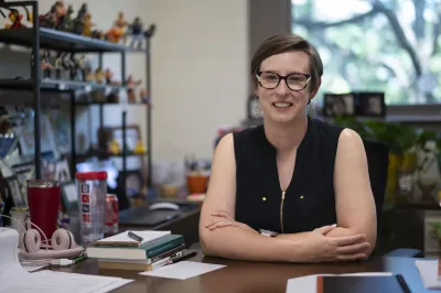 picture of Krista Thomason sitting at her desk in her office
