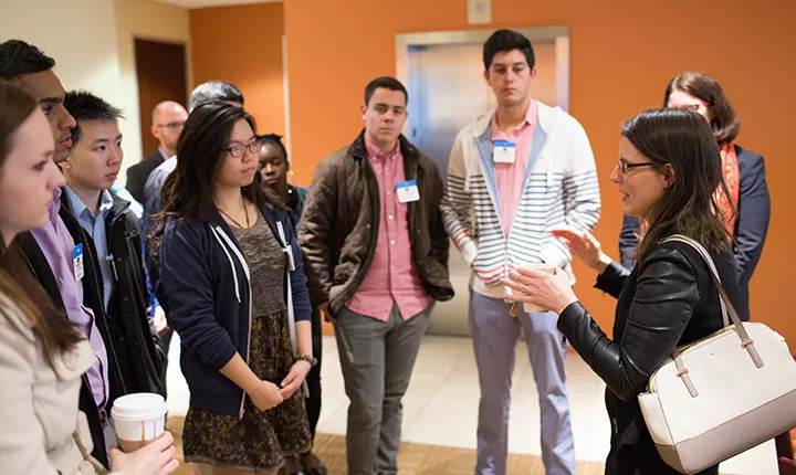 Cathy Polinksy '99 with students at Salesforce