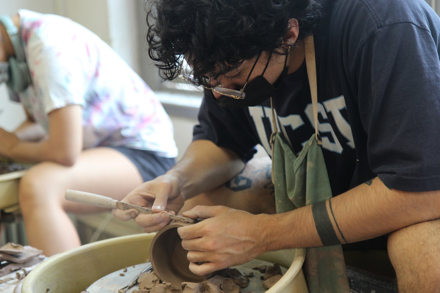 Ceramics class, Beardsley Hall, student at work