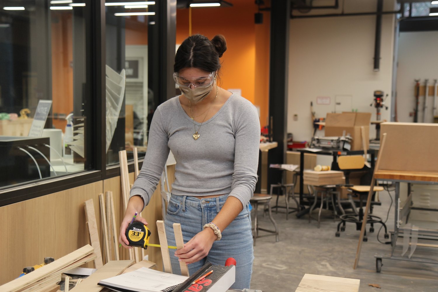 Art student working inside the MakerSpace during a Sculpture I course.
