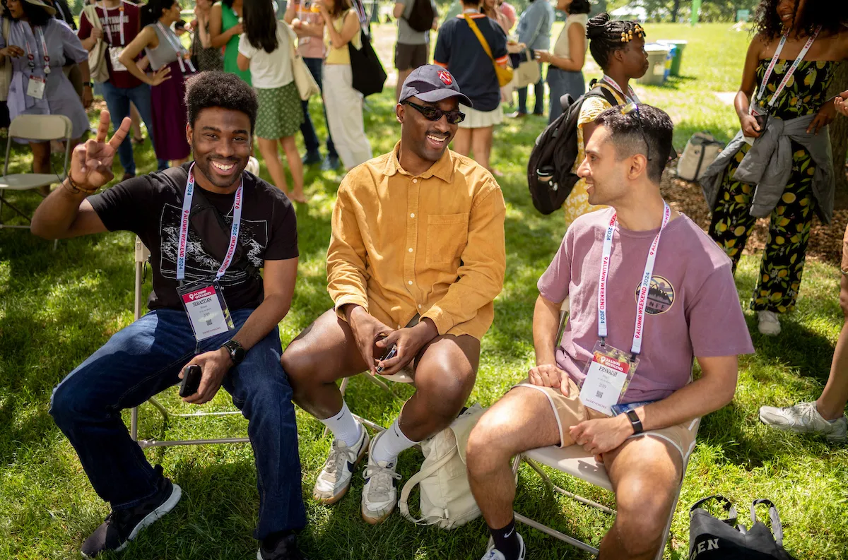 Student sit on chairs in outdoor amphitheater