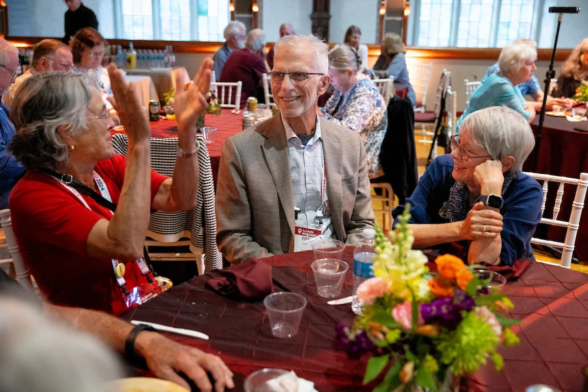 Alumni sit at table in Upper Tarble