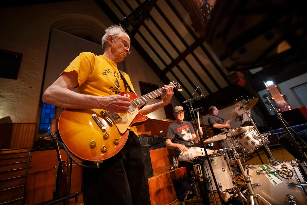 Alum plays guitar in Upper Tarble