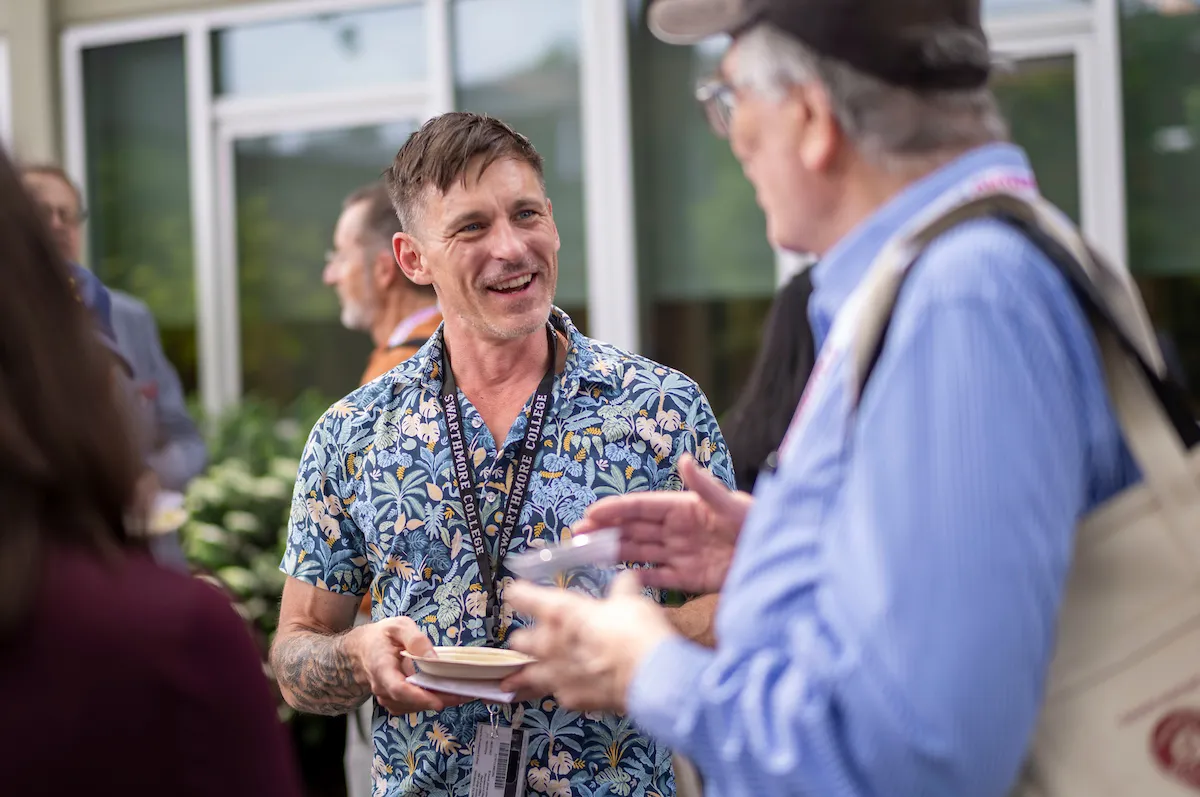 Alums mingle outdoor at event