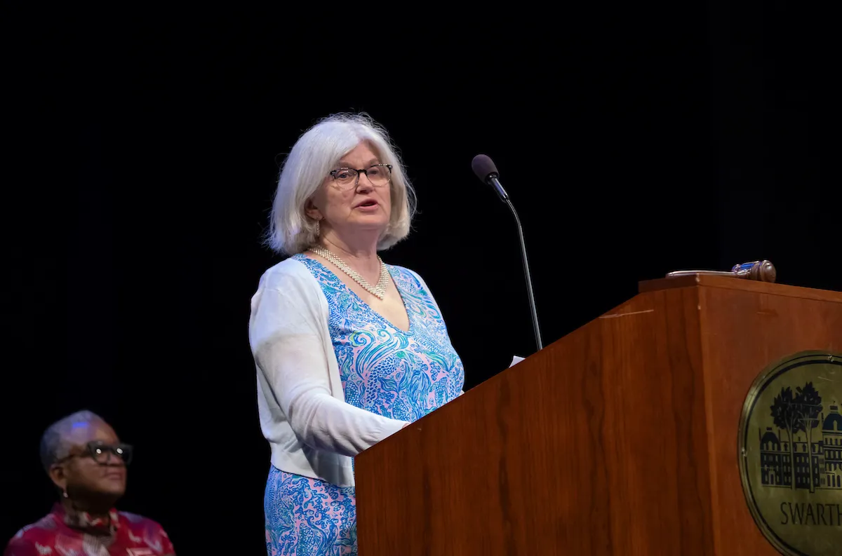 Person speaks at podium during collection