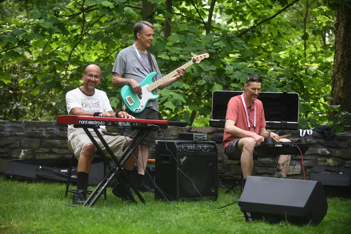 Rock band performs in outdoor amphitheater