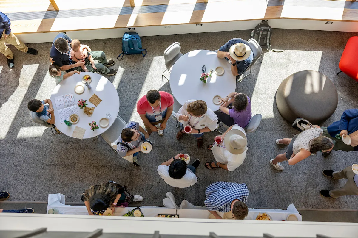 Overhead shot og alumni gathered for food and drinks