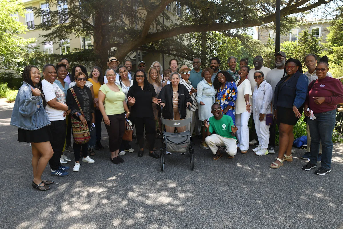 Group of black alumni congregate near Robinson House and BCC