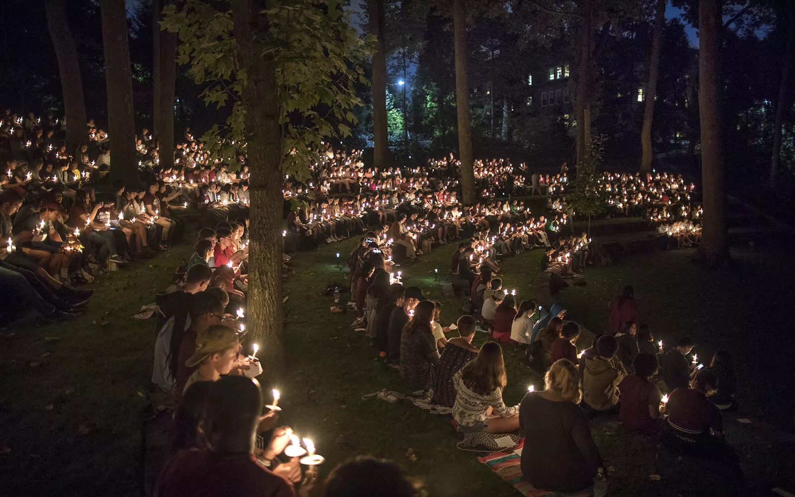 Students with candles at first collection