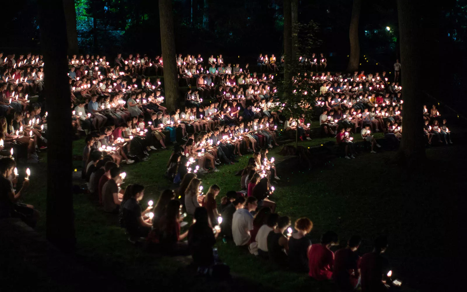 Students with candles at first collection