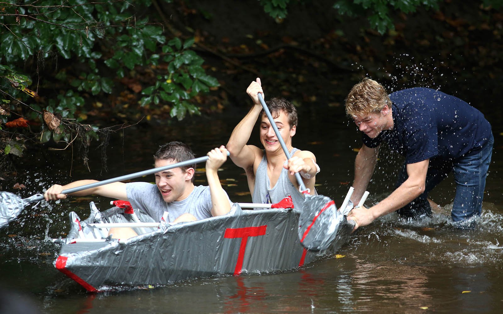Students on canoe in a creek
