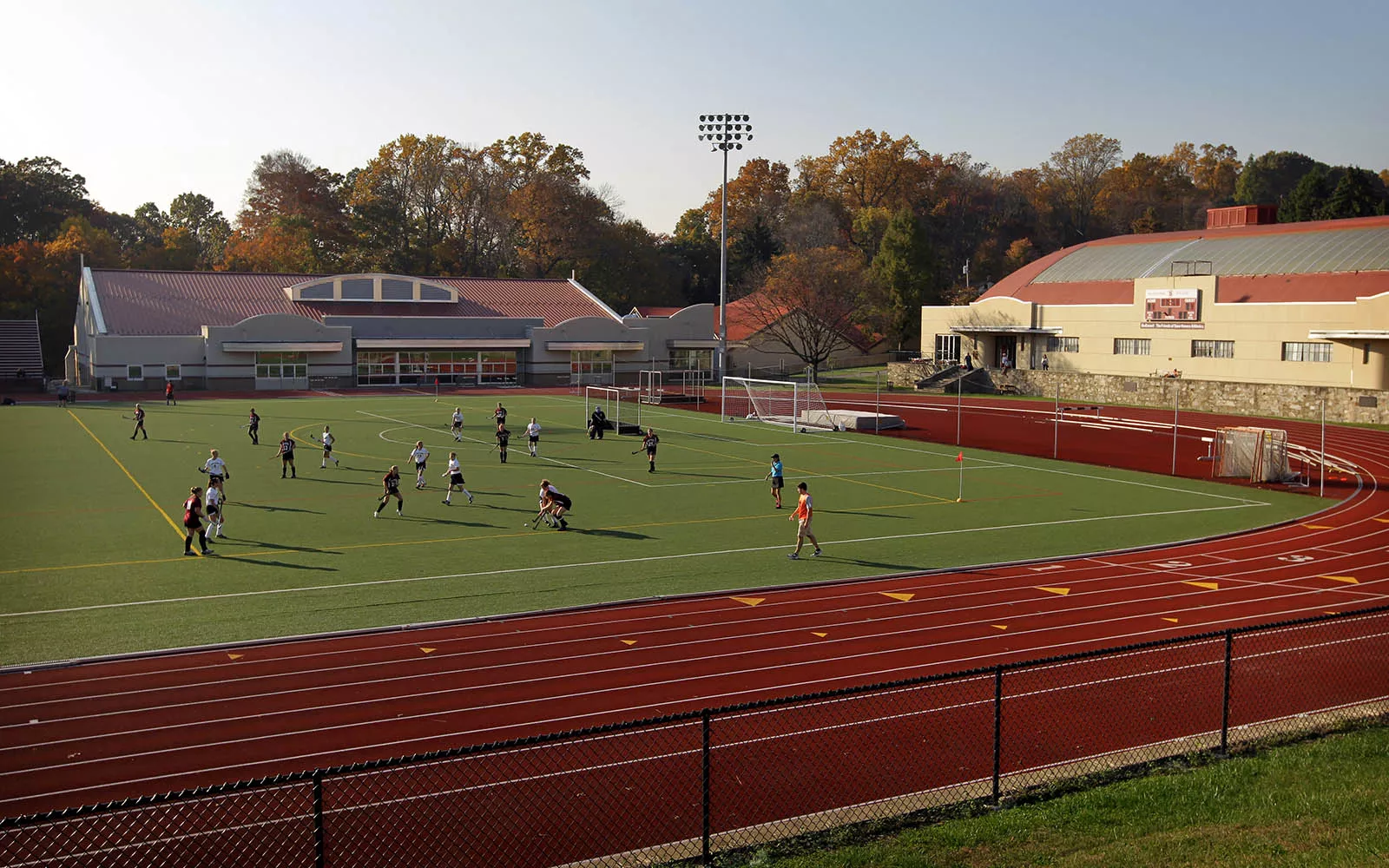 People playing on Swarthmore track inner grass 