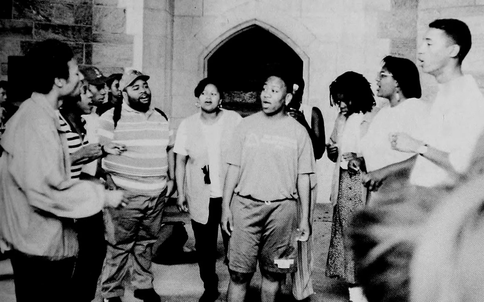 group of students singing in the bell tower