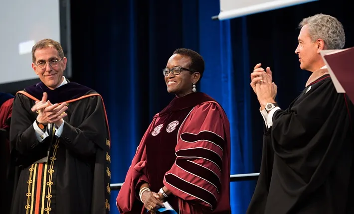 Princeton University President Christopher Eisgruber, President Valerie Smith, and Chair of the Board of Managers Tom Spock '78.