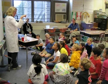 Professor Kathleen Howard teaches third-graders from a nearby school all about polymers.
