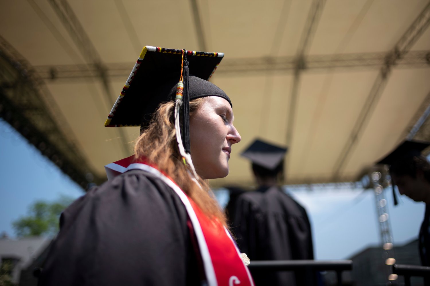 Student walks at commencement