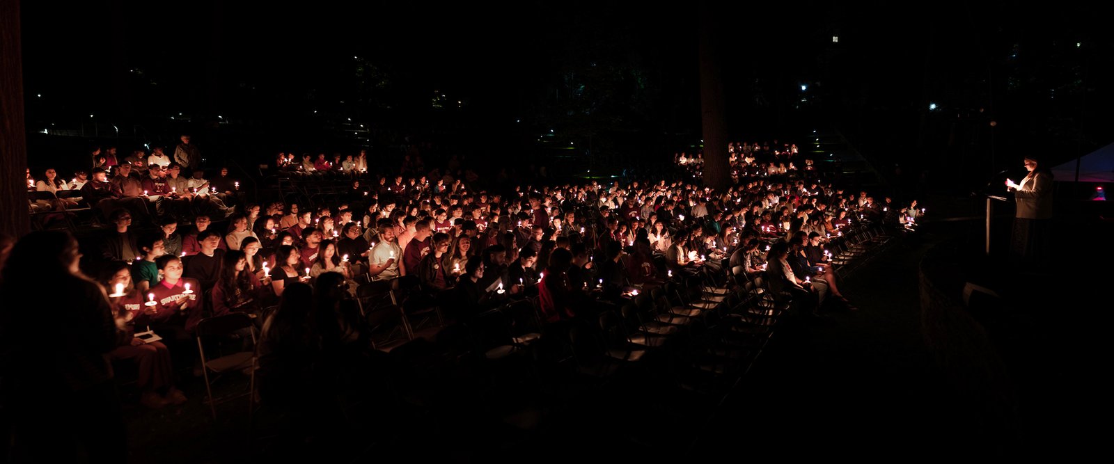 Panorama shot of Class of 2023 with candles