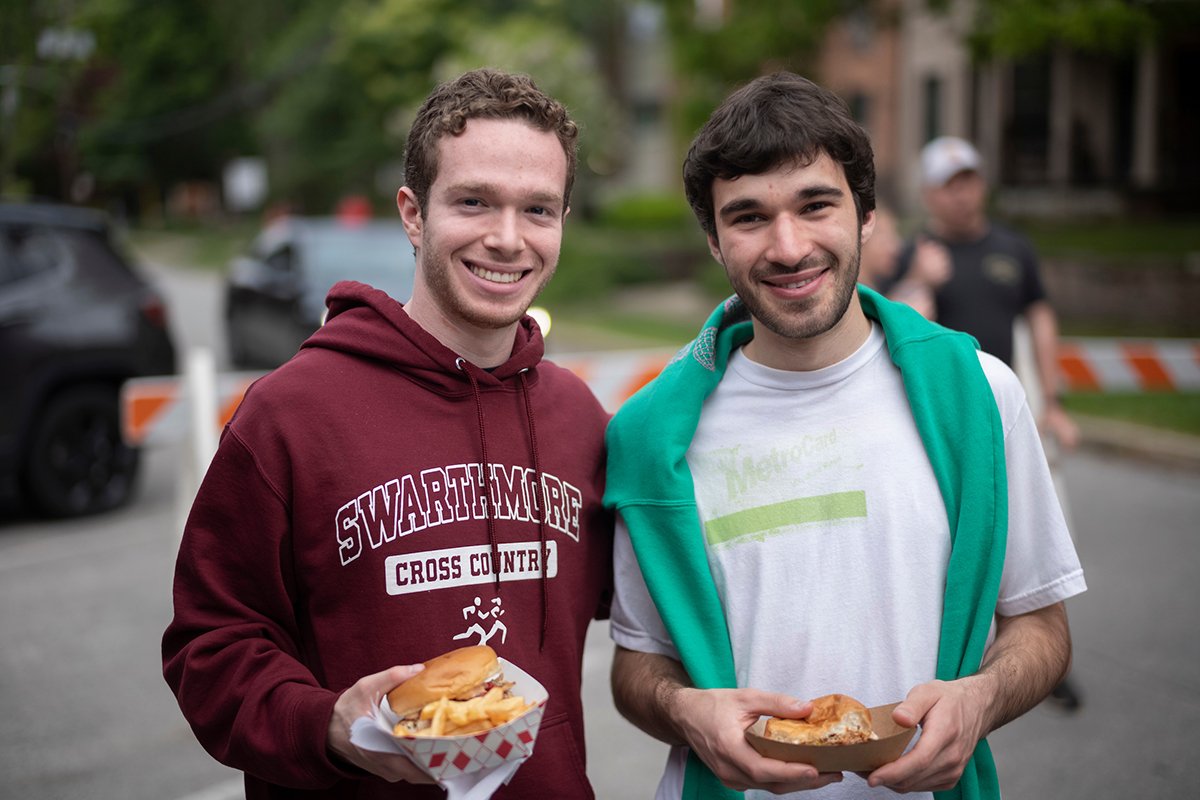 Two students pose with food in Ville of Swarthmore