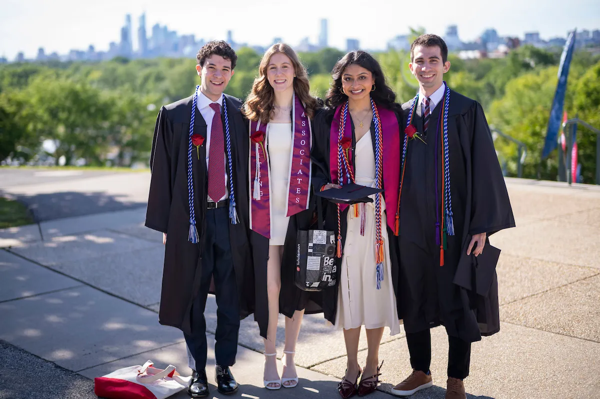 Group of students smiling before commencement ceremony