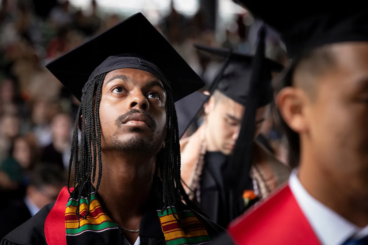 Student looks up at commencement