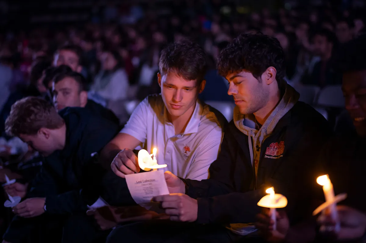 Student share candle flame at Last Collection