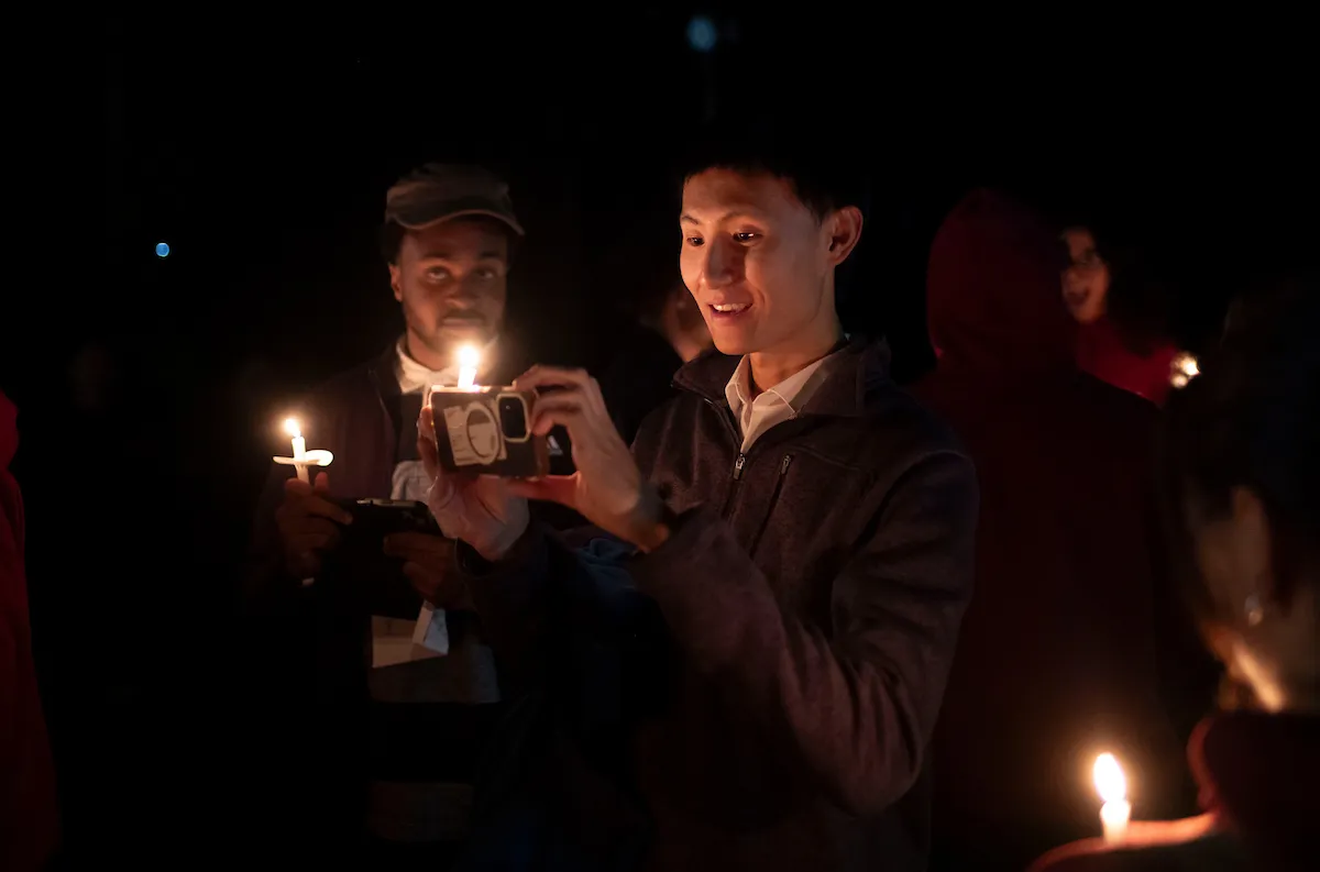Students with candles at Last Collection