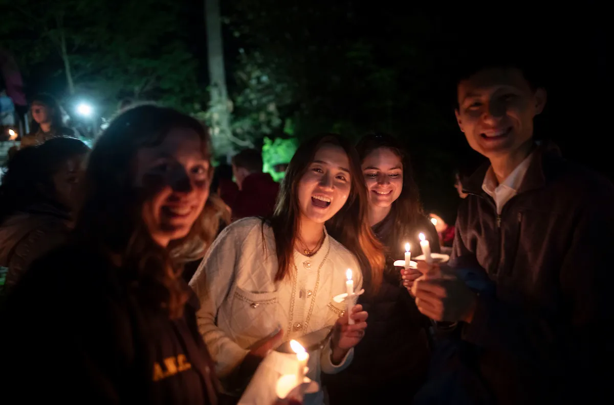 Students with candles at Last Collection