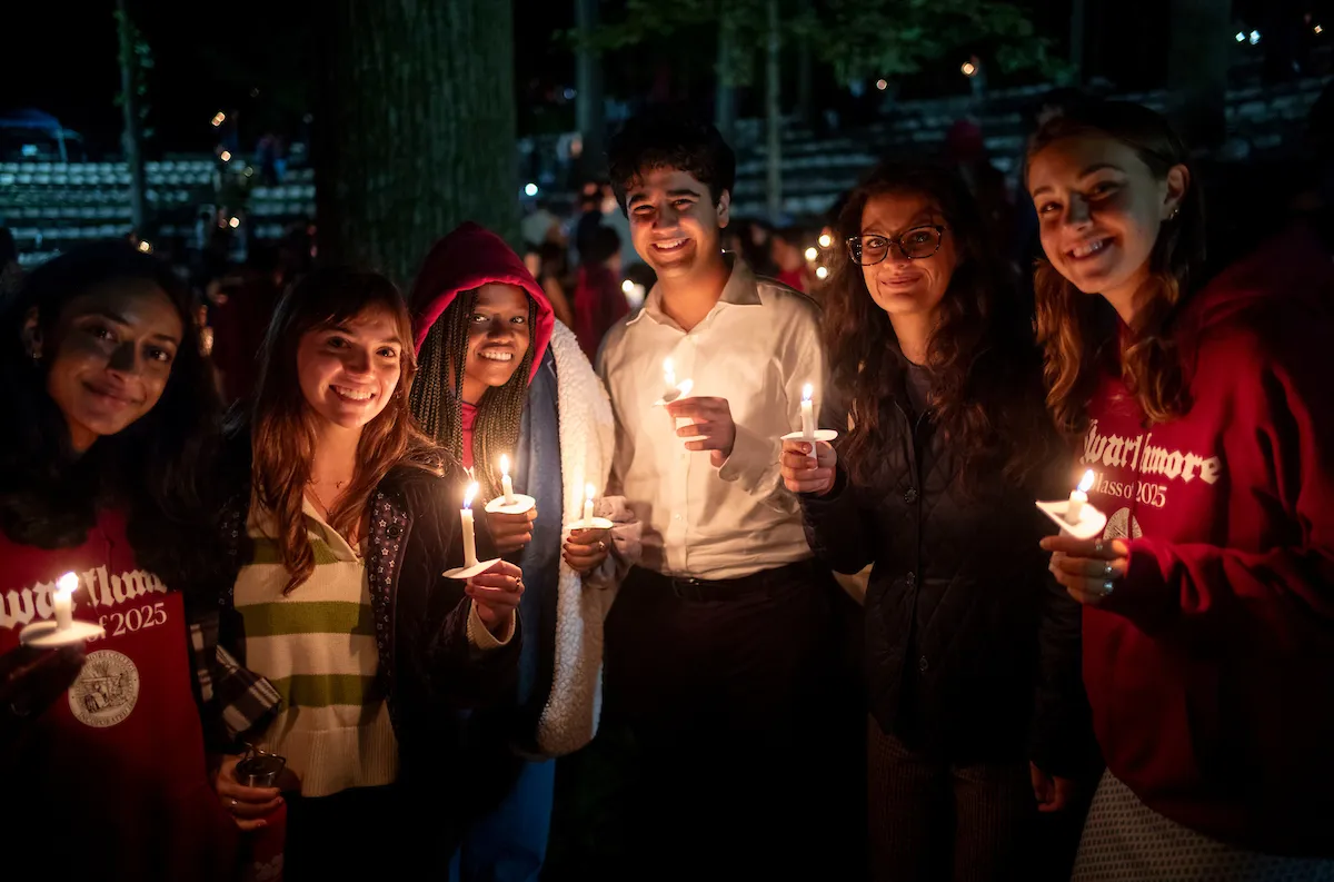 Students pose with candles at last collection